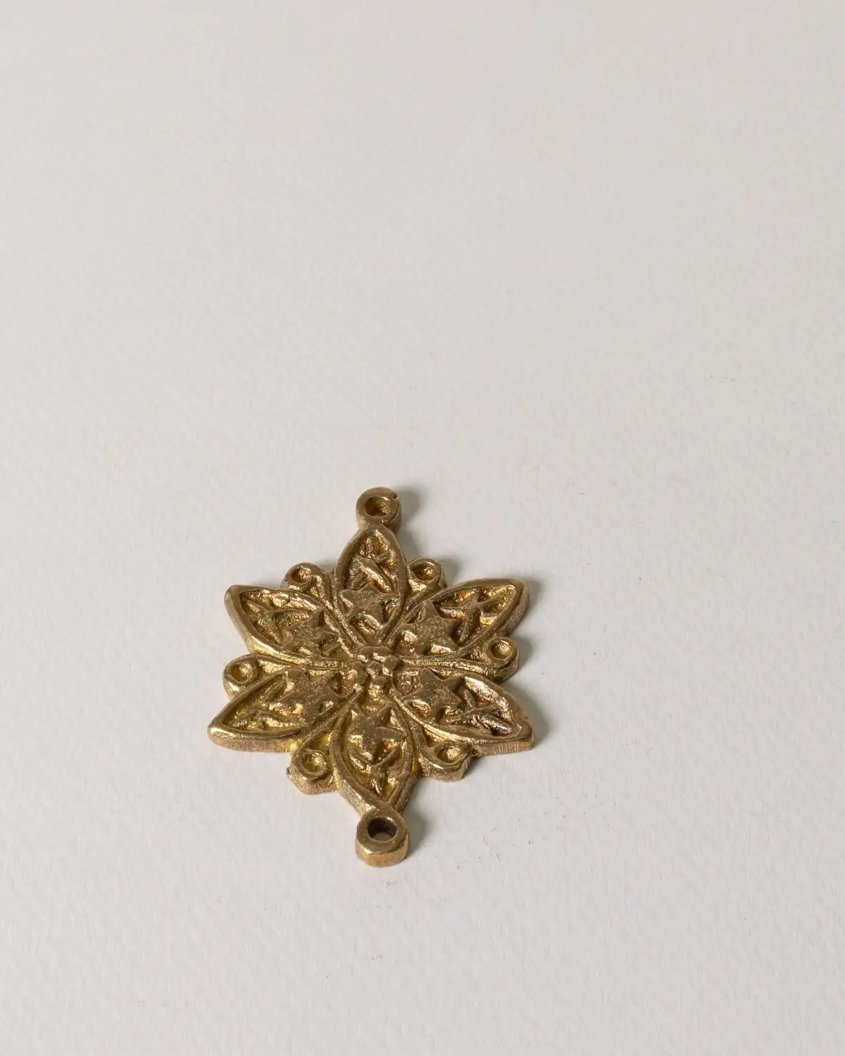 Colgante flor de bronce