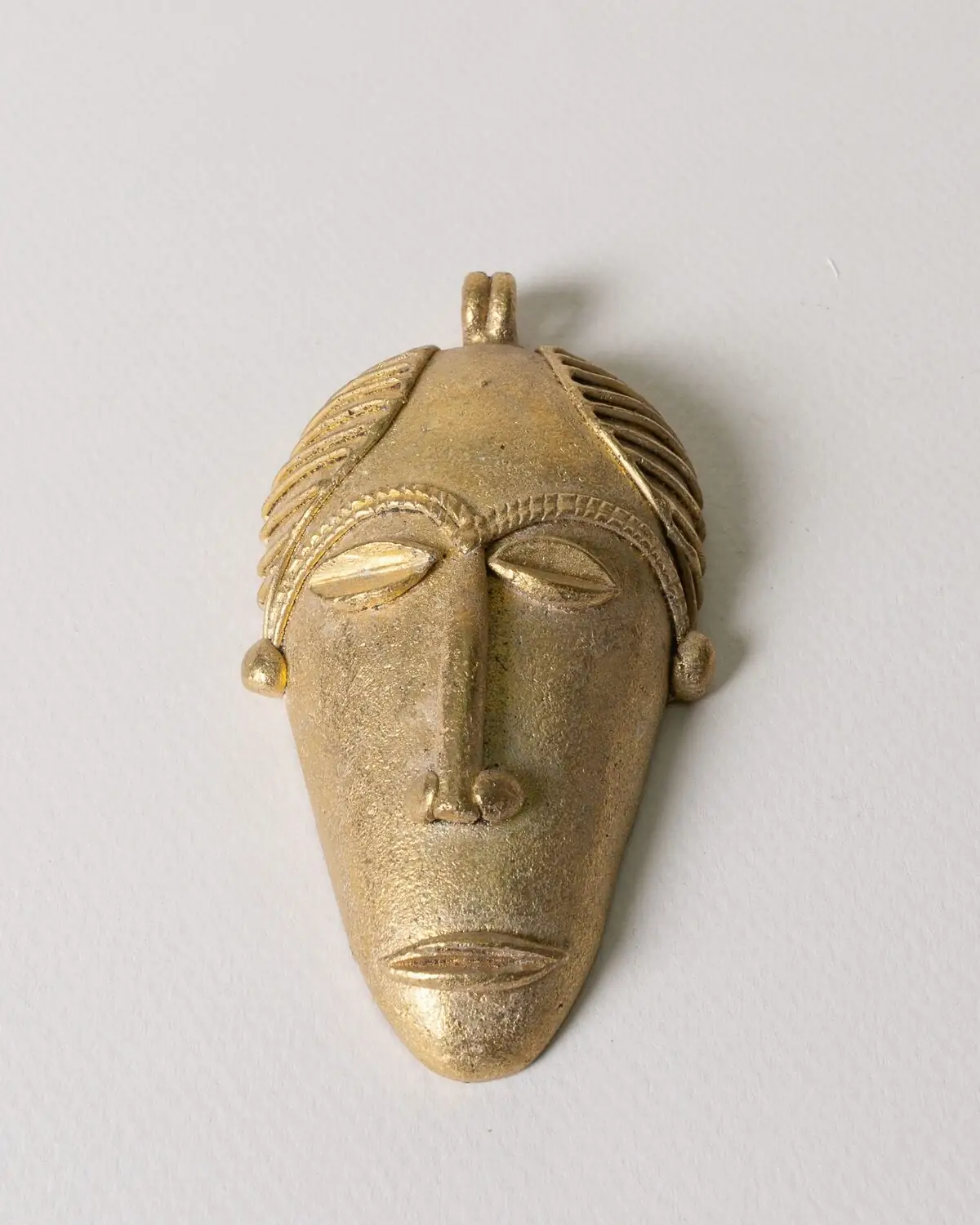 Máscara de bronce hecha a mano